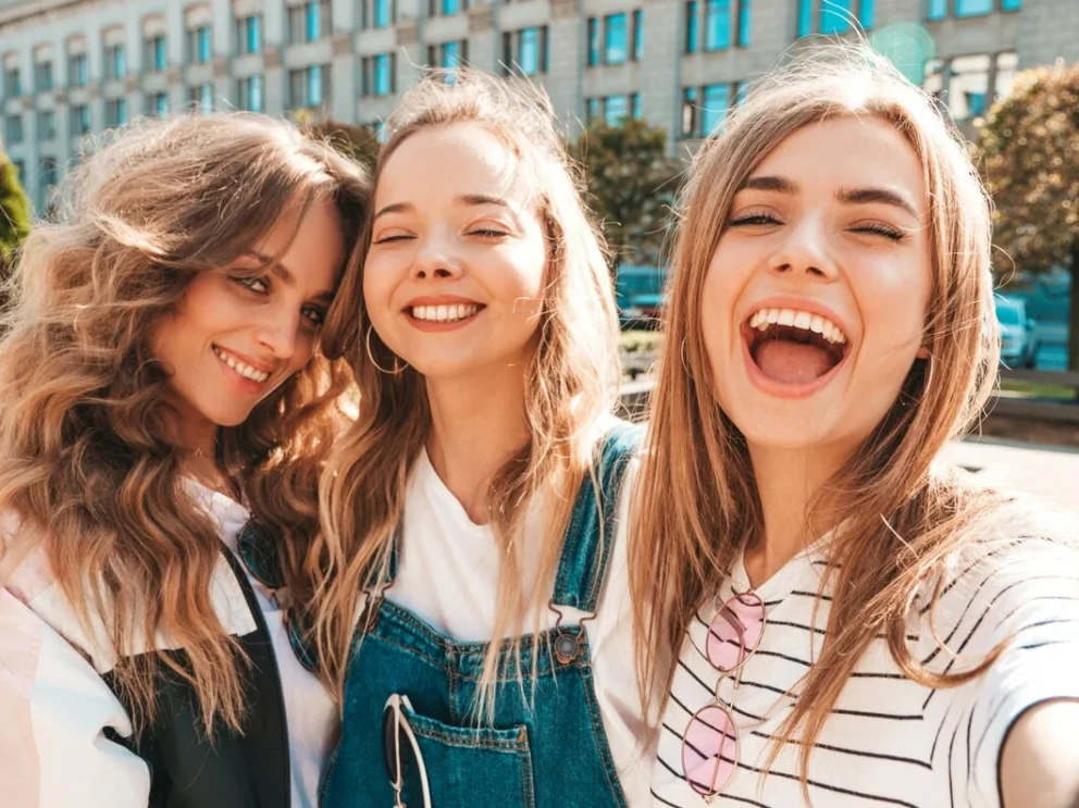 three-young-smiling-hipster-women-summer-clothes-girls-taking-selfie-self-portrait-photos-smartphone-models-posing-street-female-showing-positive-face-emotions_158538-6798