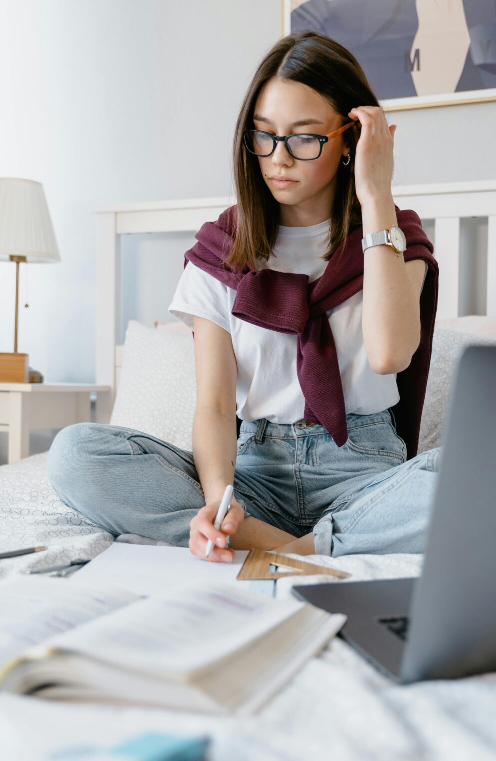 college woman studying before her Invisalign new york city appointment